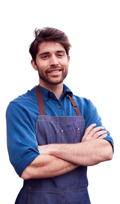 Portrait of a confident small business owner standing with folded arms, representing entrepreneurs seeking business financing and funding solutions.